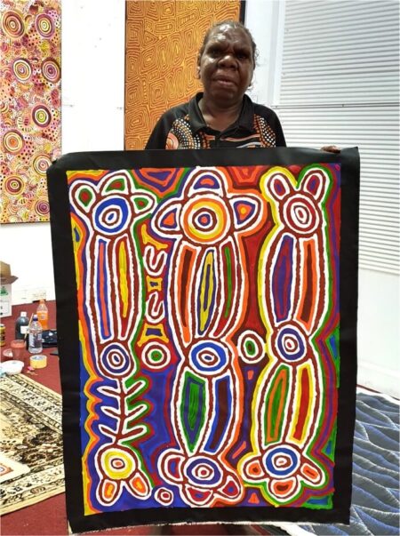 Australian Aboriginal artist Angela Robertson with artwork No.15963